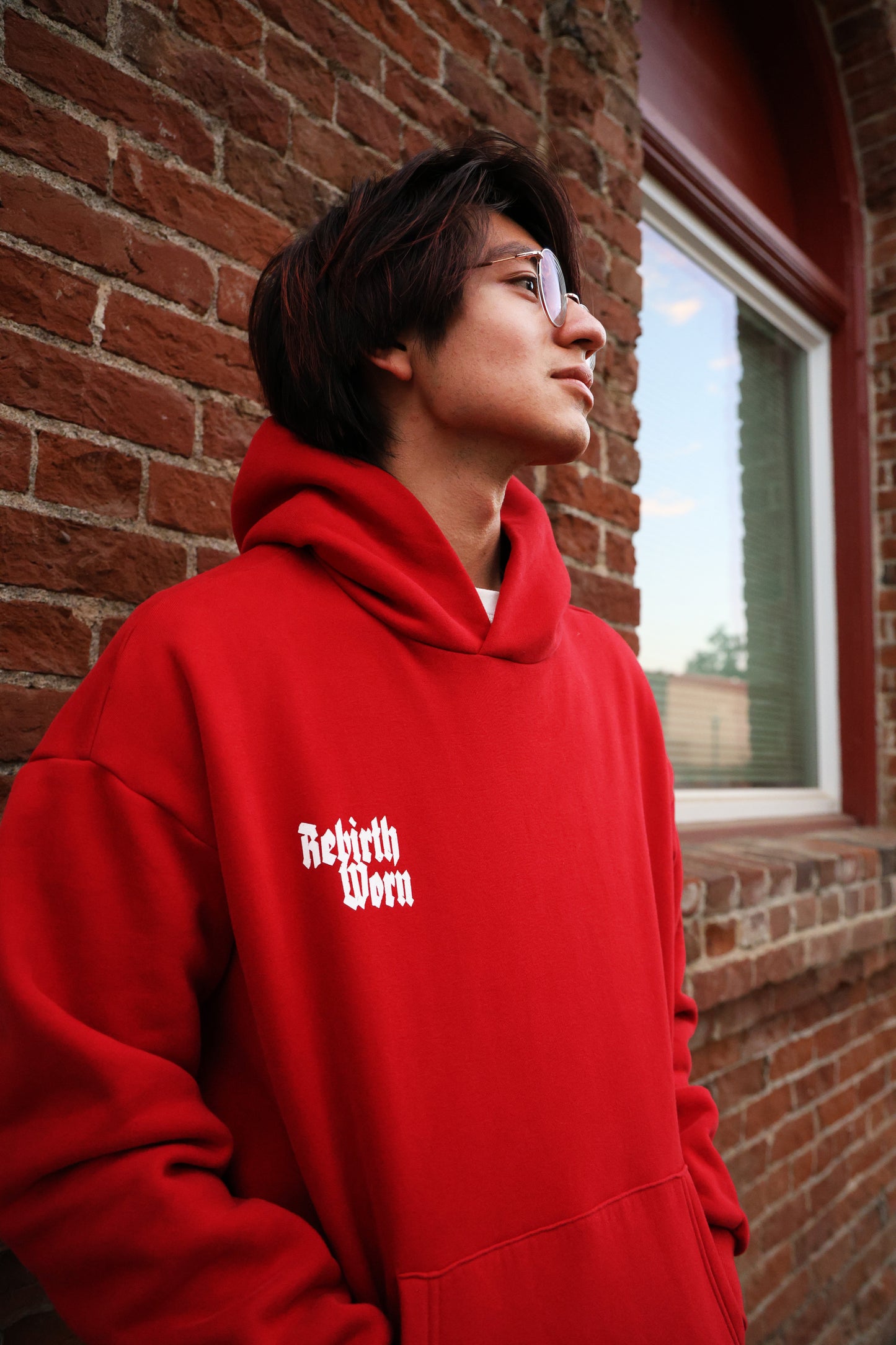 Front view of Rebirth Angel Wings Oversize Hoodie burgundy featuring angel wings and 555 angel number symbolism