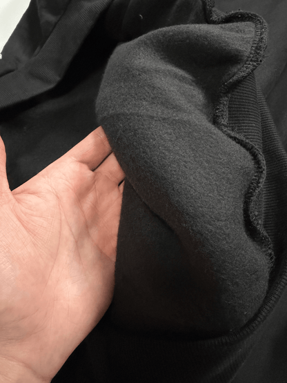 Close-up of soft heavyweight fleece fabric inside the Rebirth Angel Oversize Hoodie showing premium cotton blend material and quality stitching