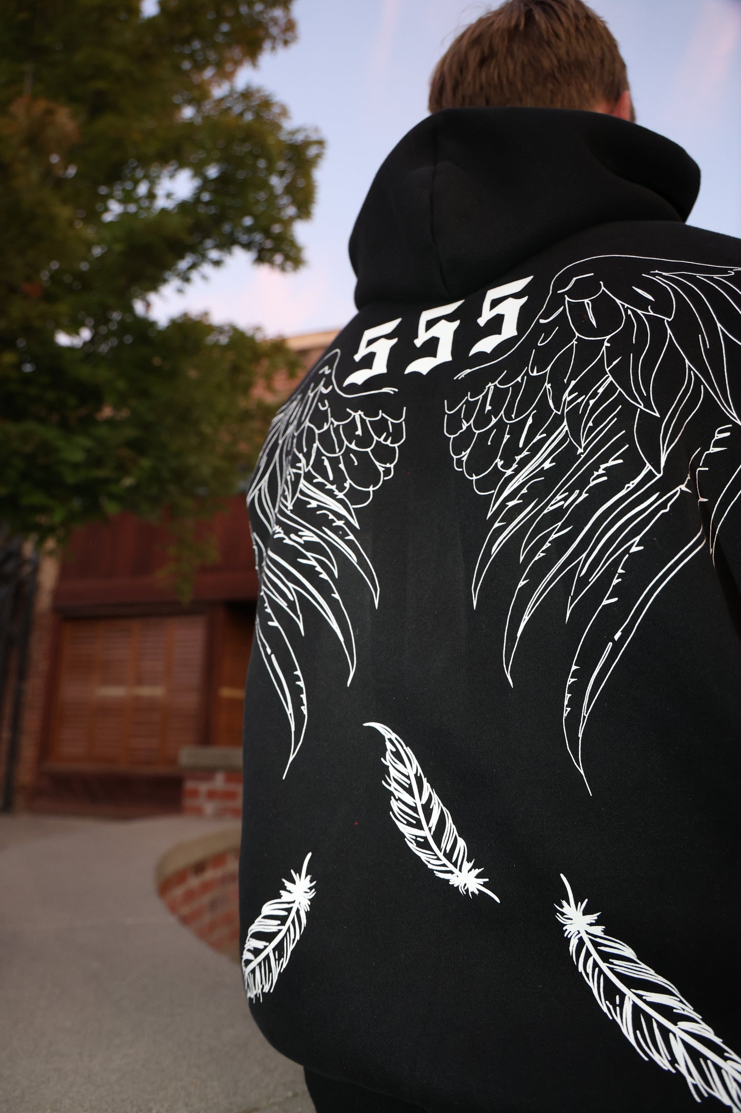 Model wearing Rebirth Angel Oversize Hoodie-lifestyle shot showing fit and styling 