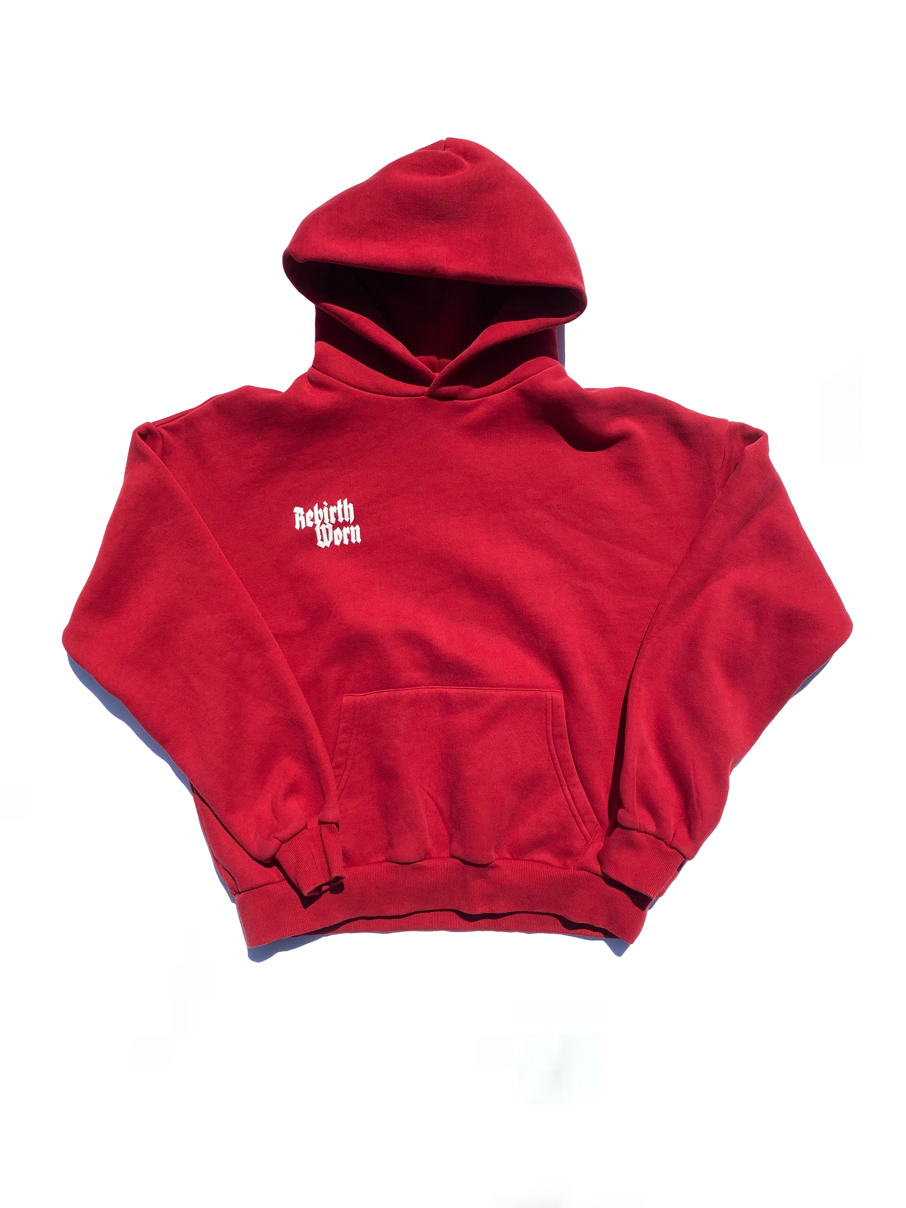 Model wearing Rebirth Angel Wings Oversize Hoodie in burgundy - front lifestyle shot showing angel wing design and 555 symbolism